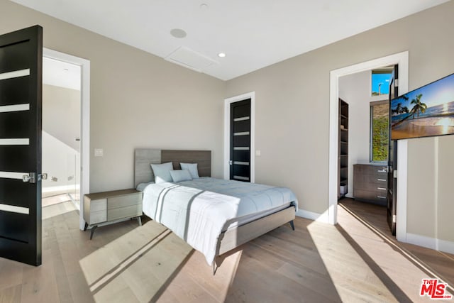 bedroom with light wood-type flooring