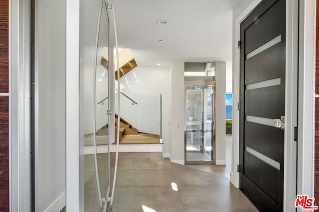 corridor with concrete flooring