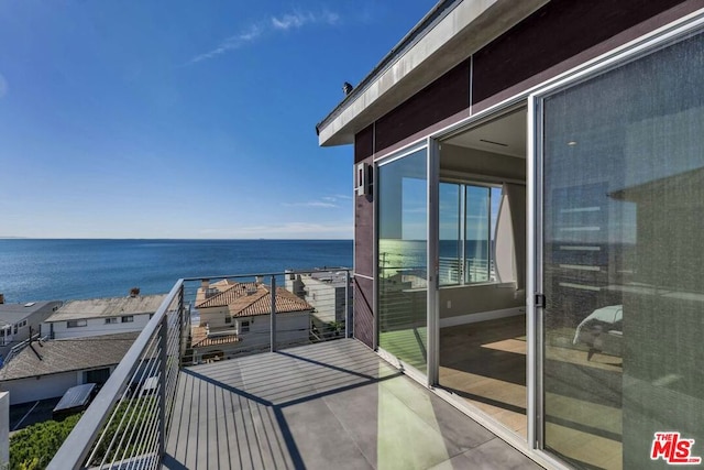 balcony featuring a water view