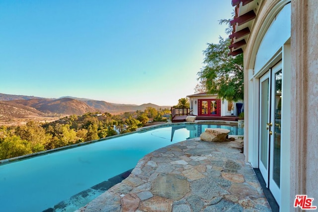 view of pool with a mountain view