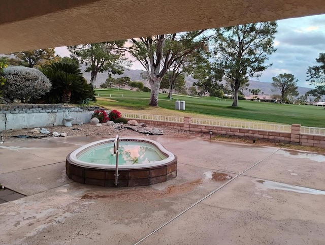 exterior space with a mountain view and a jacuzzi