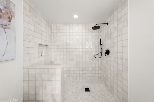 bathroom with tiled shower