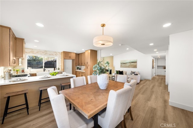 dining space featuring light wood-type flooring