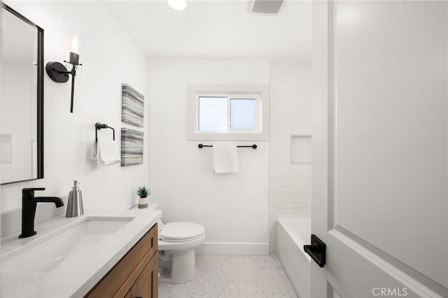 full bathroom with vanity, toilet, and tiled shower / bath combo