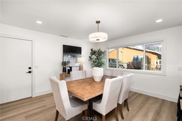 dining room with light wood-type flooring