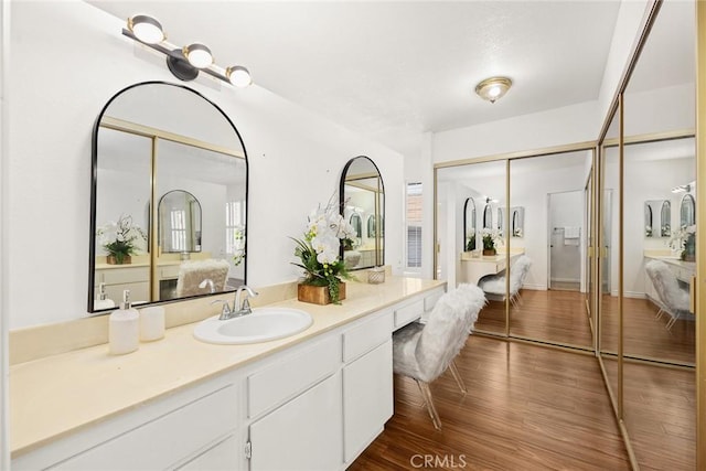 bathroom featuring vanity and hardwood / wood-style floors