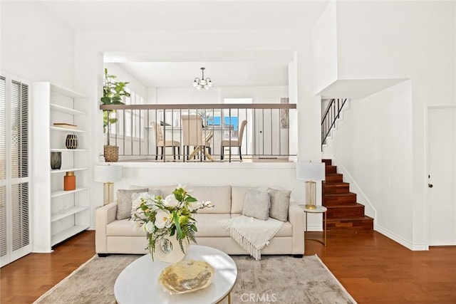 living room featuring hardwood / wood-style flooring and a notable chandelier