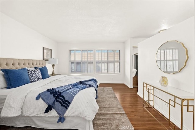 bedroom featuring dark wood-type flooring