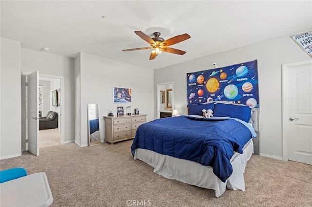 bedroom with ceiling fan and light carpet