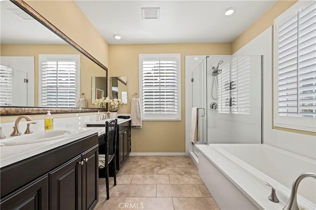 bathroom featuring tile patterned floors, vanity, separate shower and tub, and a healthy amount of sunlight