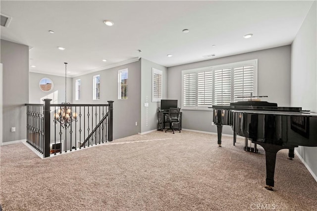 sitting room with carpet, crown molding, a notable chandelier, and a healthy amount of sunlight