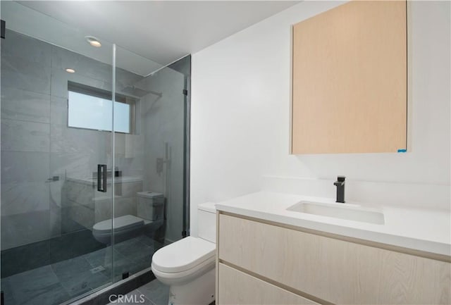 bathroom featuring vanity, toilet, tile patterned flooring, and a shower with door