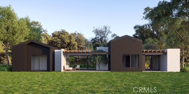 rear view of house with a lawn