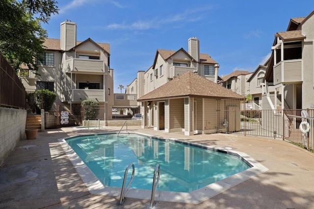 view of swimming pool with a patio