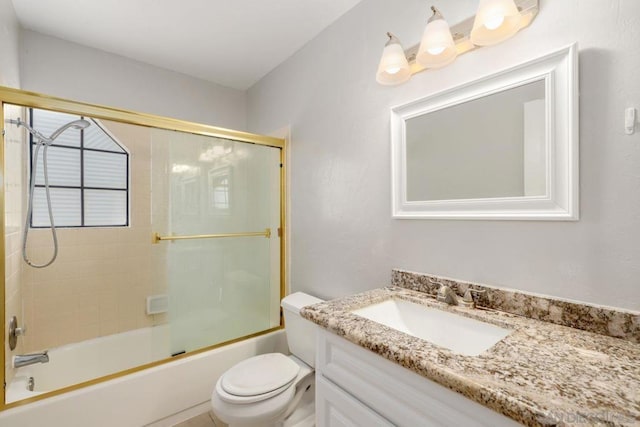 full bathroom with toilet, vanity, and shower / bath combination with glass door