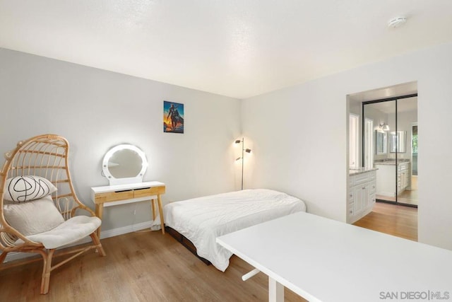 bedroom with a closet and light wood-type flooring