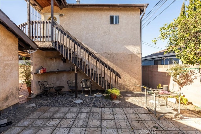 back of house with a patio