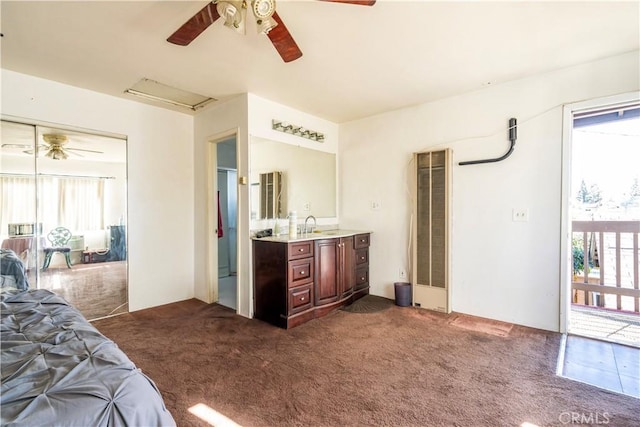 carpeted bedroom featuring multiple windows and ceiling fan