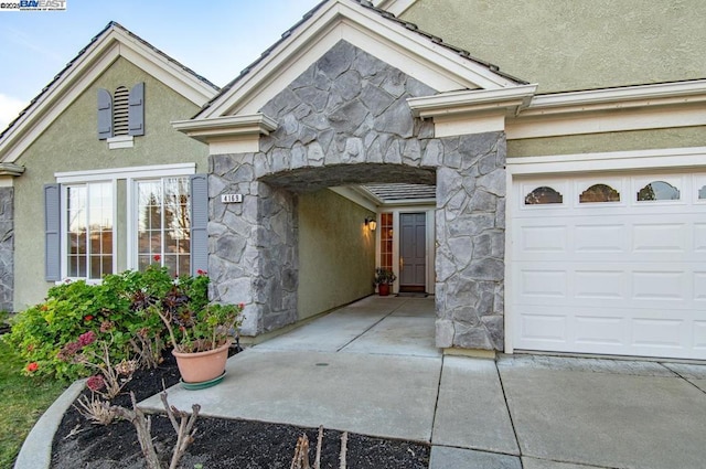 doorway to property featuring a garage