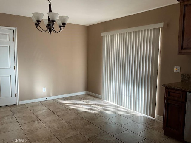 unfurnished dining area featuring a notable chandelier and light tile patterned flooring