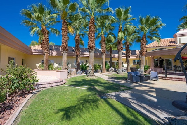 view of yard with an outdoor living space and a patio area