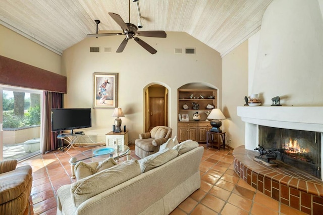 living room featuring a fireplace, built in features, light tile patterned floors, and wood ceiling