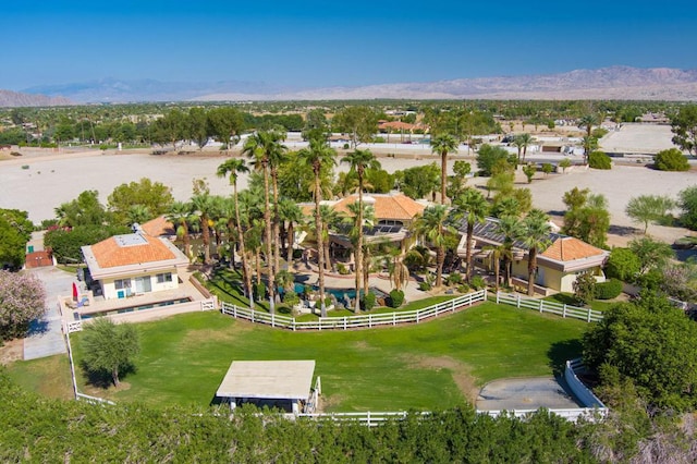 birds eye view of property with a mountain view