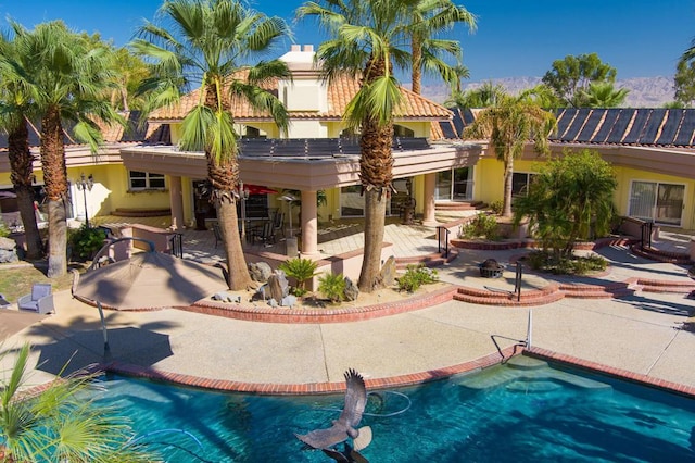 view of swimming pool with a patio