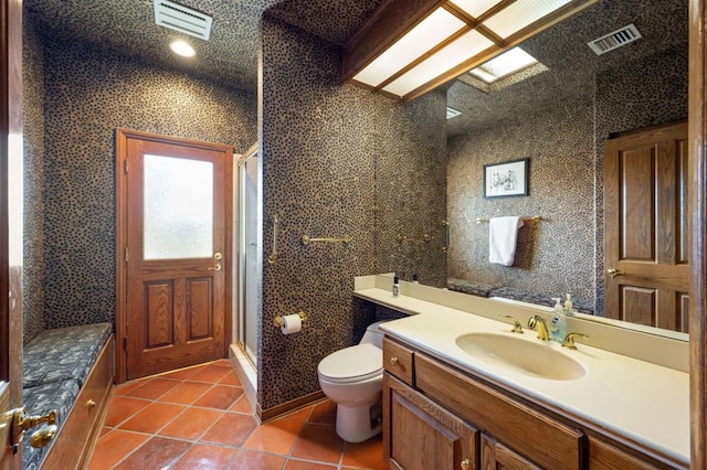 bathroom with walk in shower, toilet, tile patterned floors, and vanity