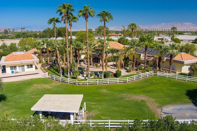 birds eye view of property with a mountain view