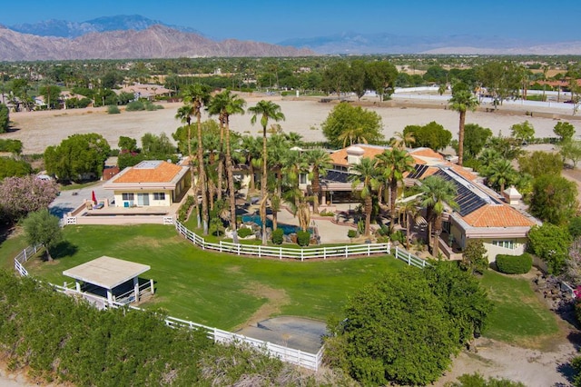 birds eye view of property featuring a mountain view