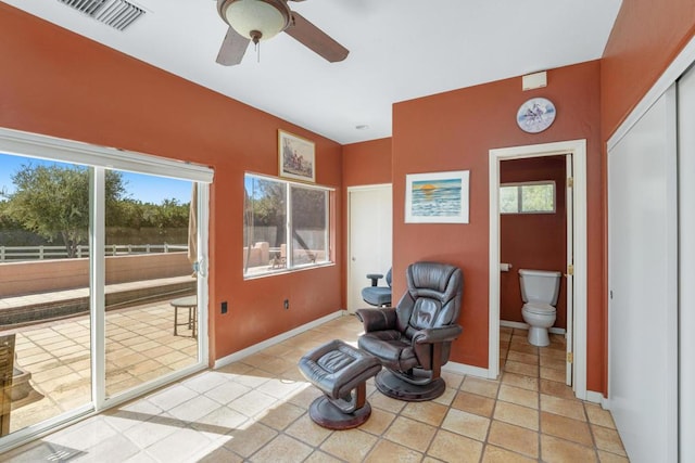 sitting room featuring ceiling fan and light tile patterned flooring