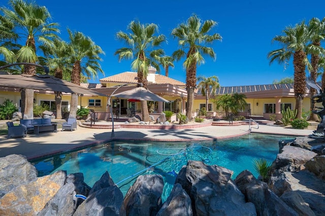 view of pool with a patio area and a gazebo