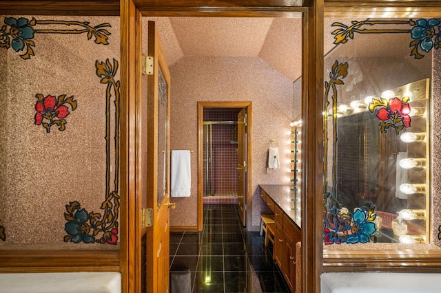 bathroom featuring lofted ceiling