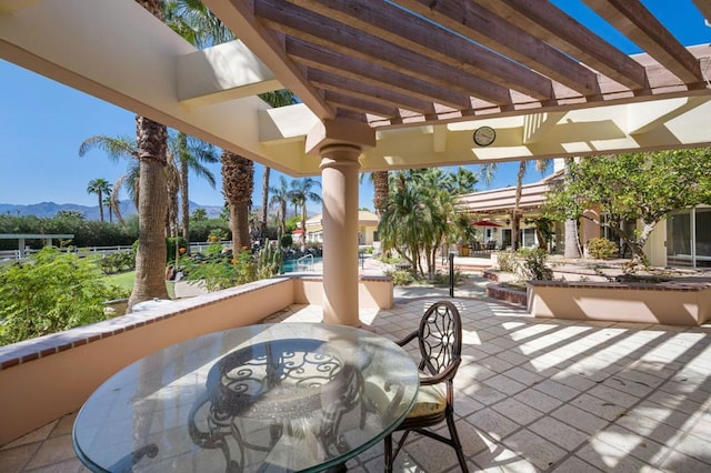 view of patio / terrace featuring a mountain view and a pergola