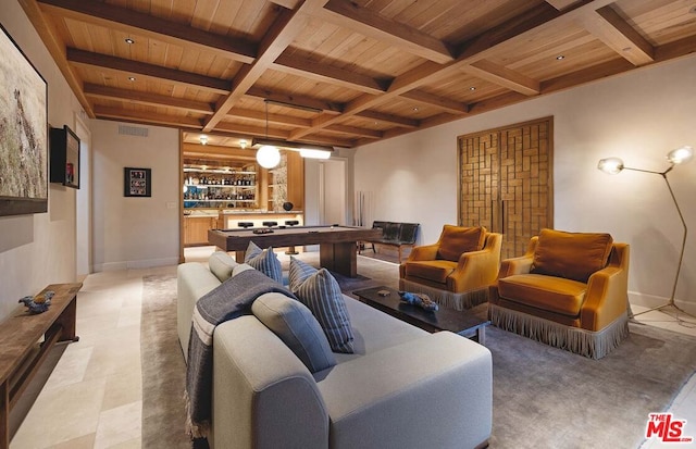 interior space with wood ceiling, billiards, beamed ceiling, and bar area