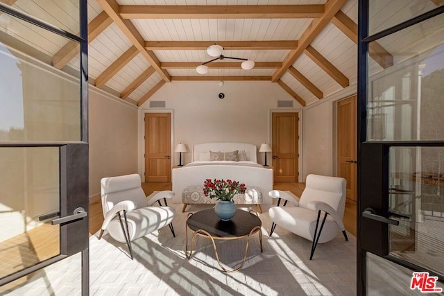 interior space featuring vaulted ceiling with beams