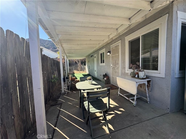 view of patio / terrace with a mountain view