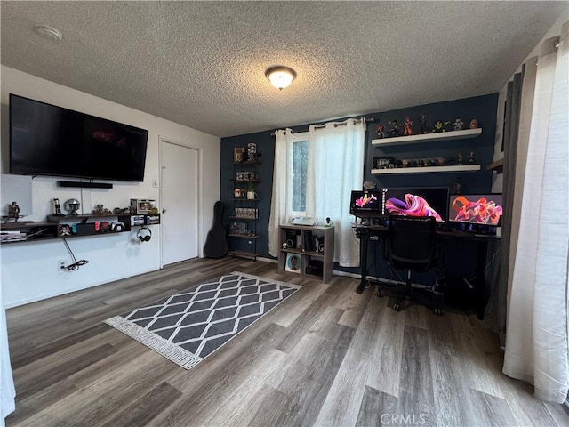 office featuring hardwood / wood-style flooring and a textured ceiling