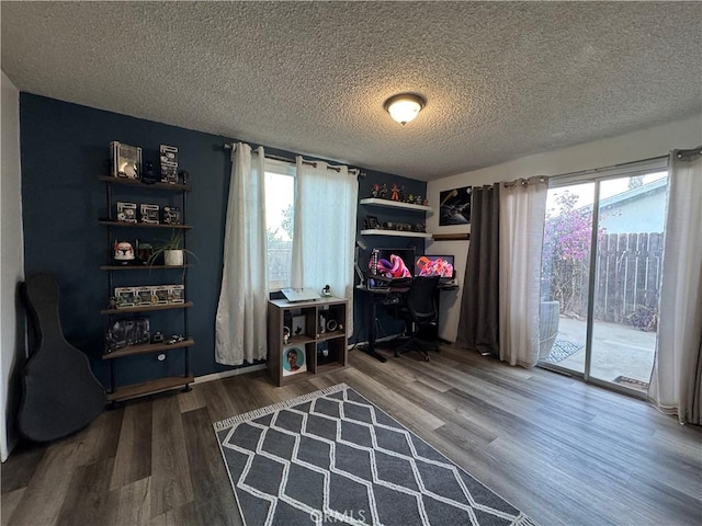 office featuring hardwood / wood-style floors and a textured ceiling