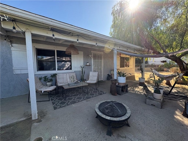 view of patio / terrace with a fire pit