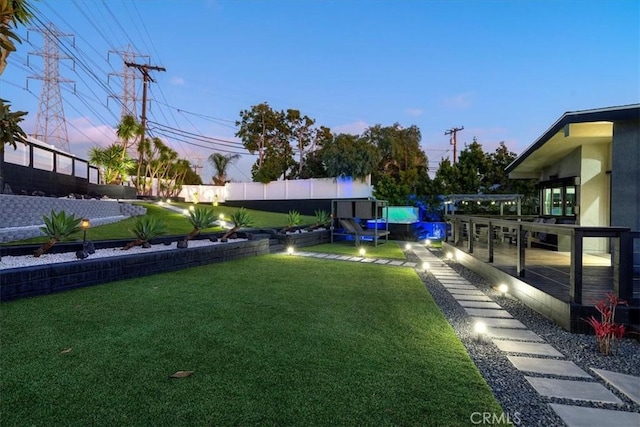 view of yard at dusk