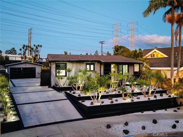 view of front of home featuring an outbuilding and a garage