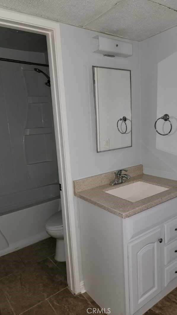 full bathroom featuring vanity, shower / bathing tub combination, and toilet