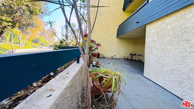 view of side of property featuring a balcony