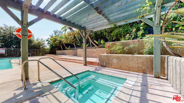 view of swimming pool with a pergola and a hot tub