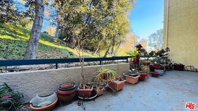 view of patio featuring a balcony