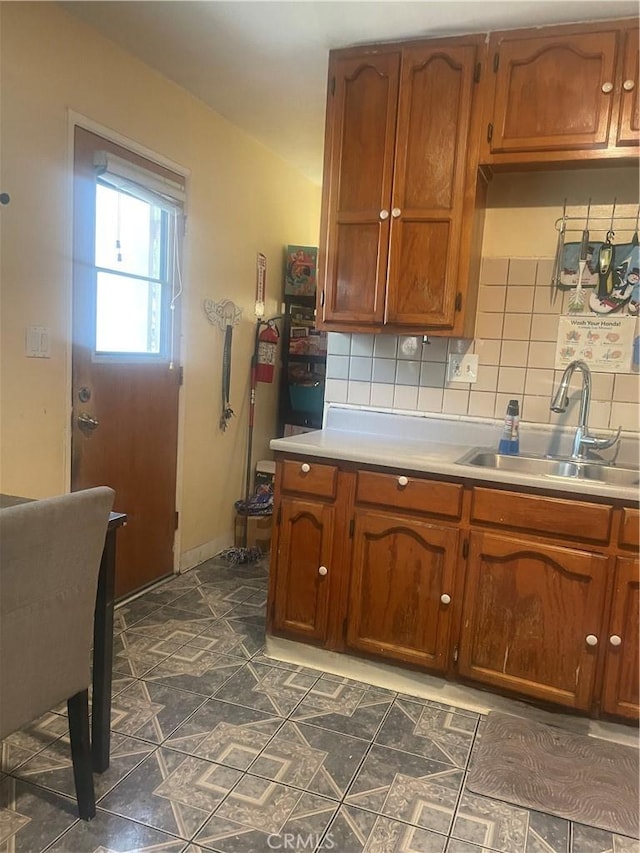 kitchen with sink and decorative backsplash