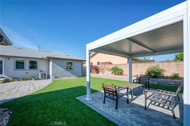 view of yard with central air condition unit and a patio