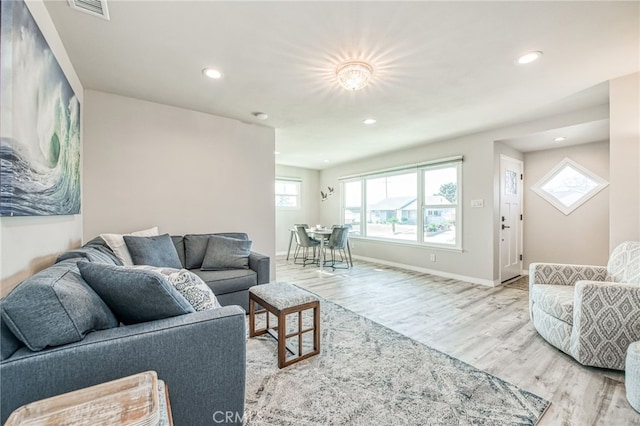 living room with light hardwood / wood-style flooring